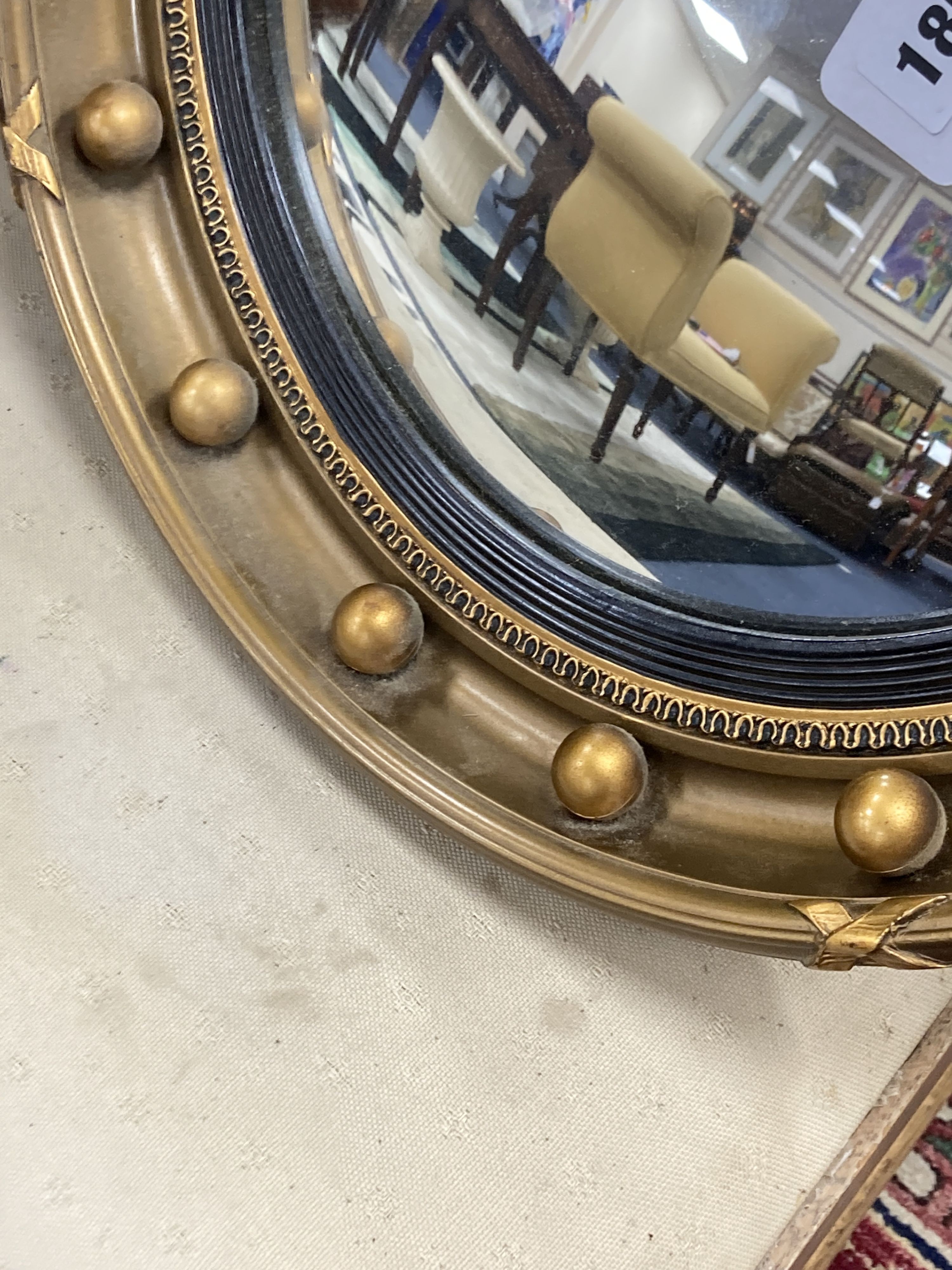 A Regency style convex wall mirror, 41 cm dia.